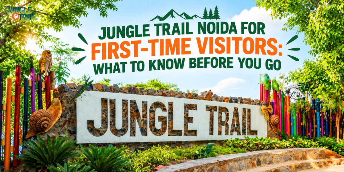 Jungle Trail Noida entrance sign surrounded by colorful bamboo-style poles, owl and parrot sculptures, and lush green plants